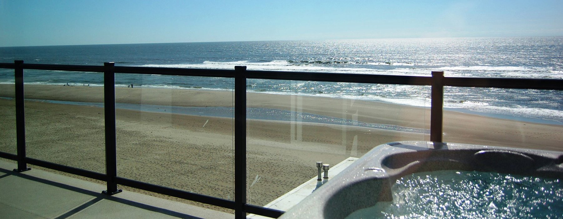hot tub on balcony overlooking ocean